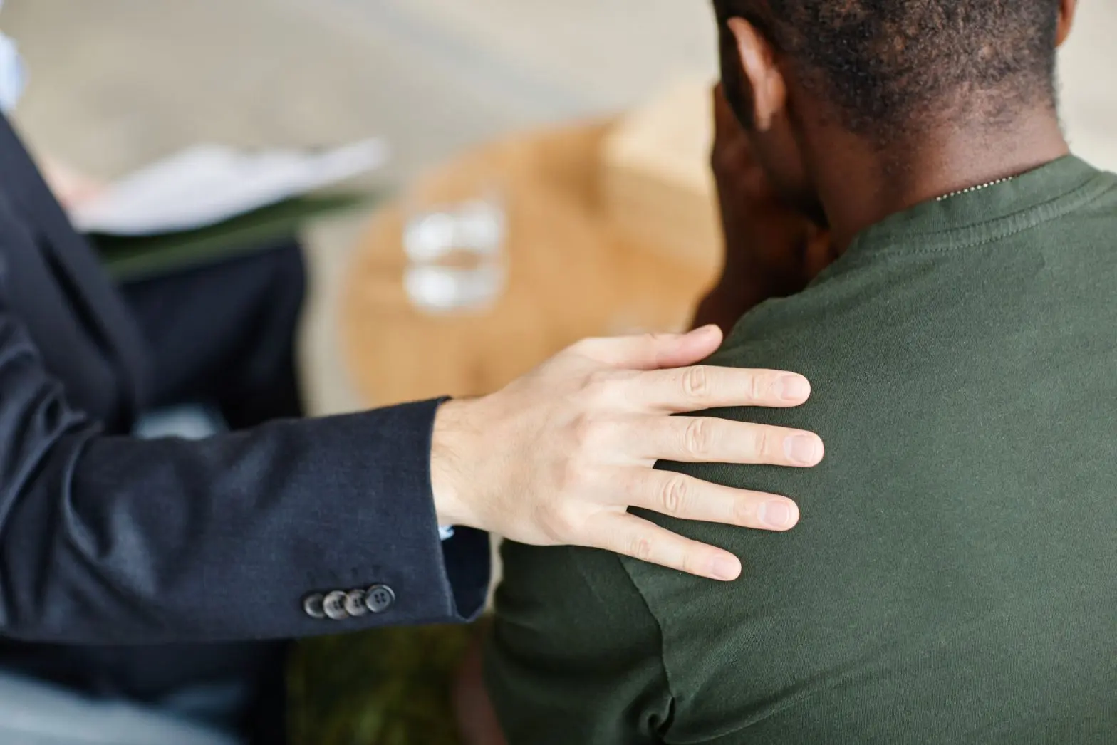 Soldier being comforted due to substance abuse in the military