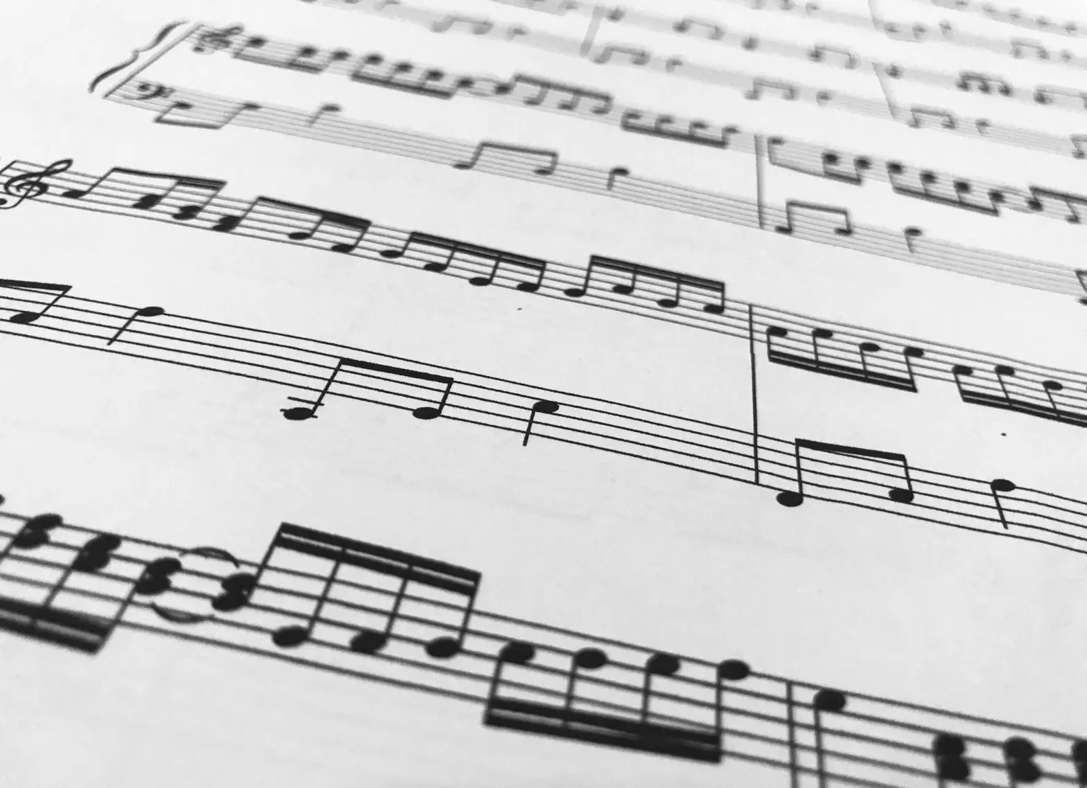 a sheet of music with black and white notes