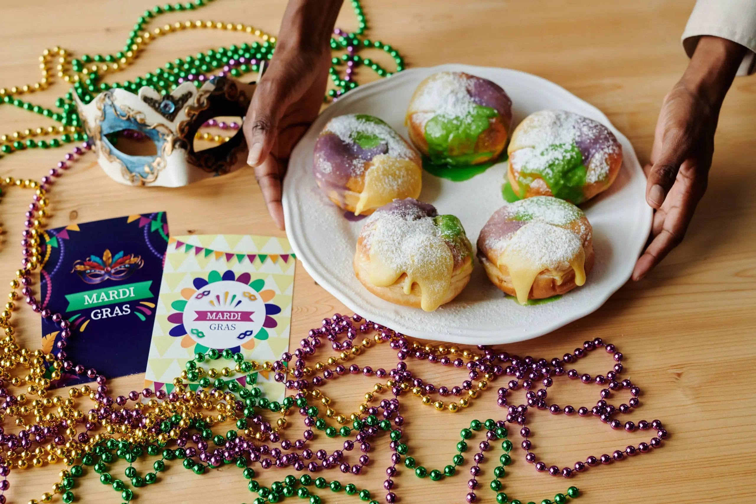 a plate of food with beads and a mask