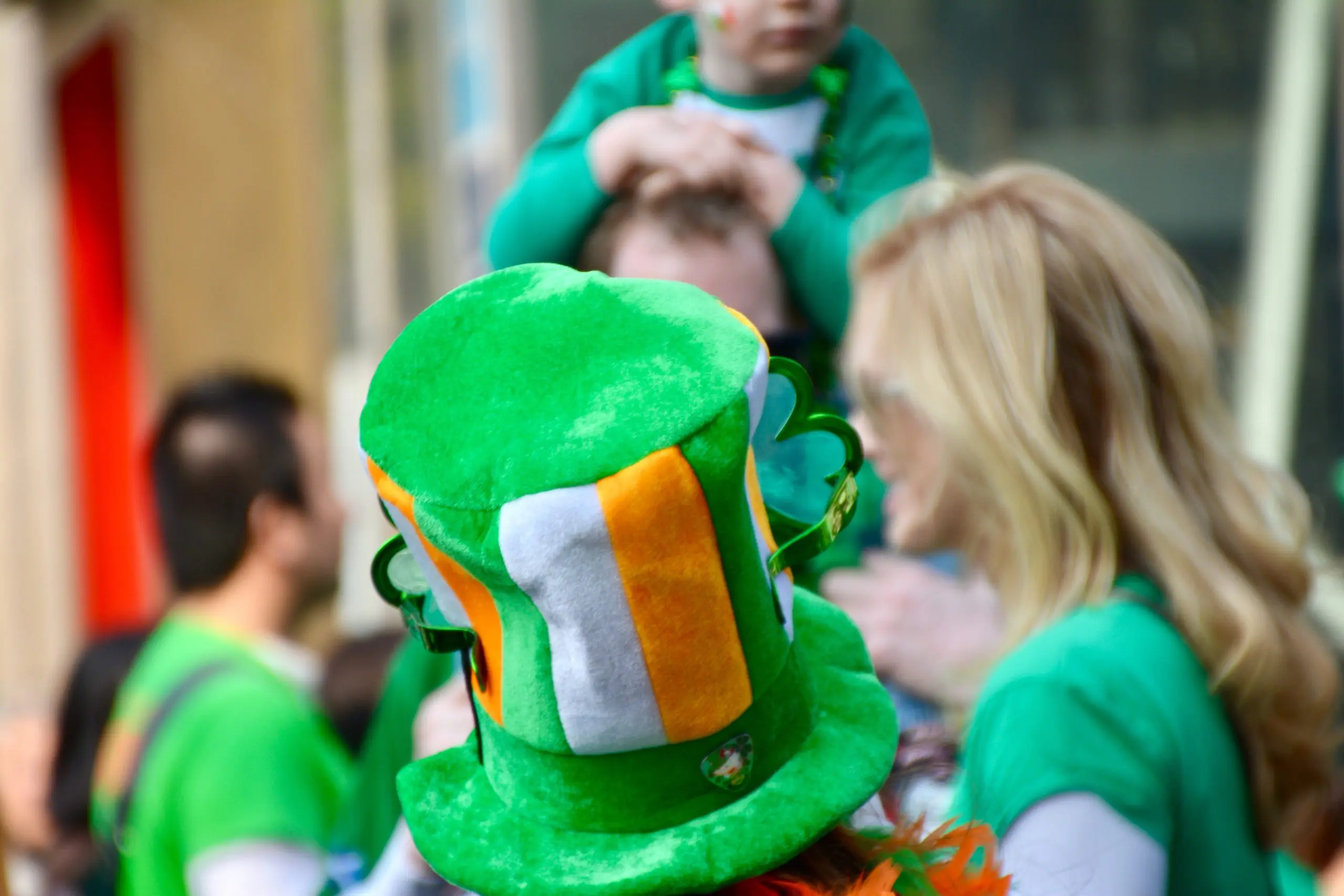 a person wearing a green hat