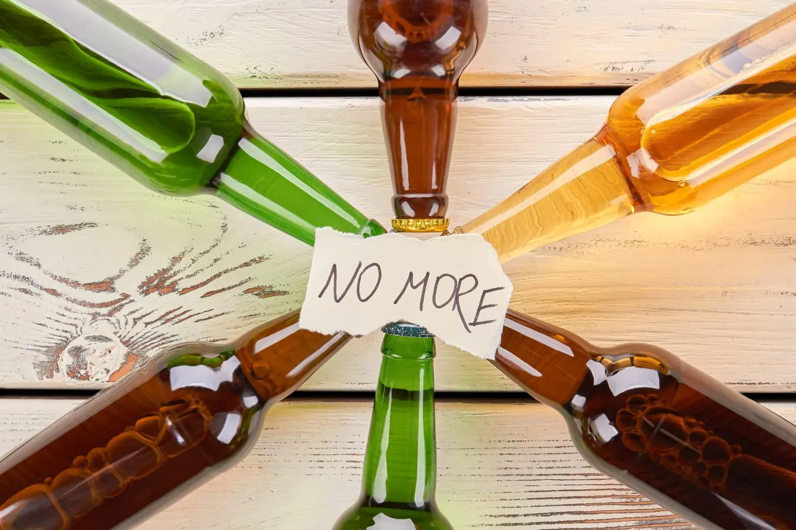 a group of bottles with a sign around them