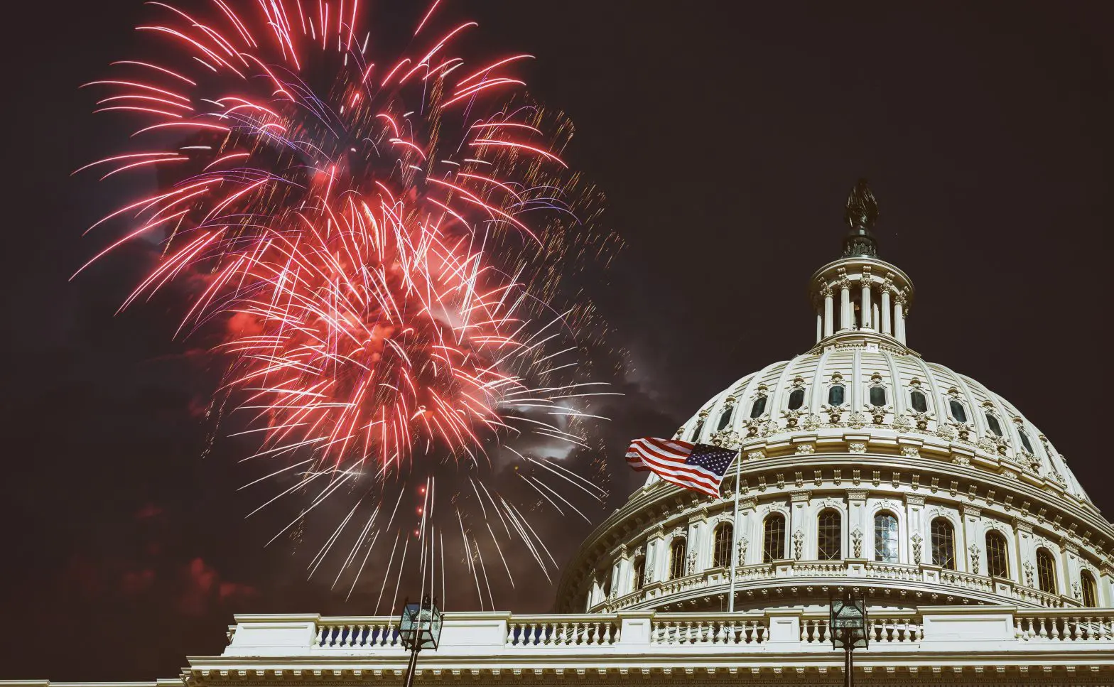 fireworks in the sky over a building