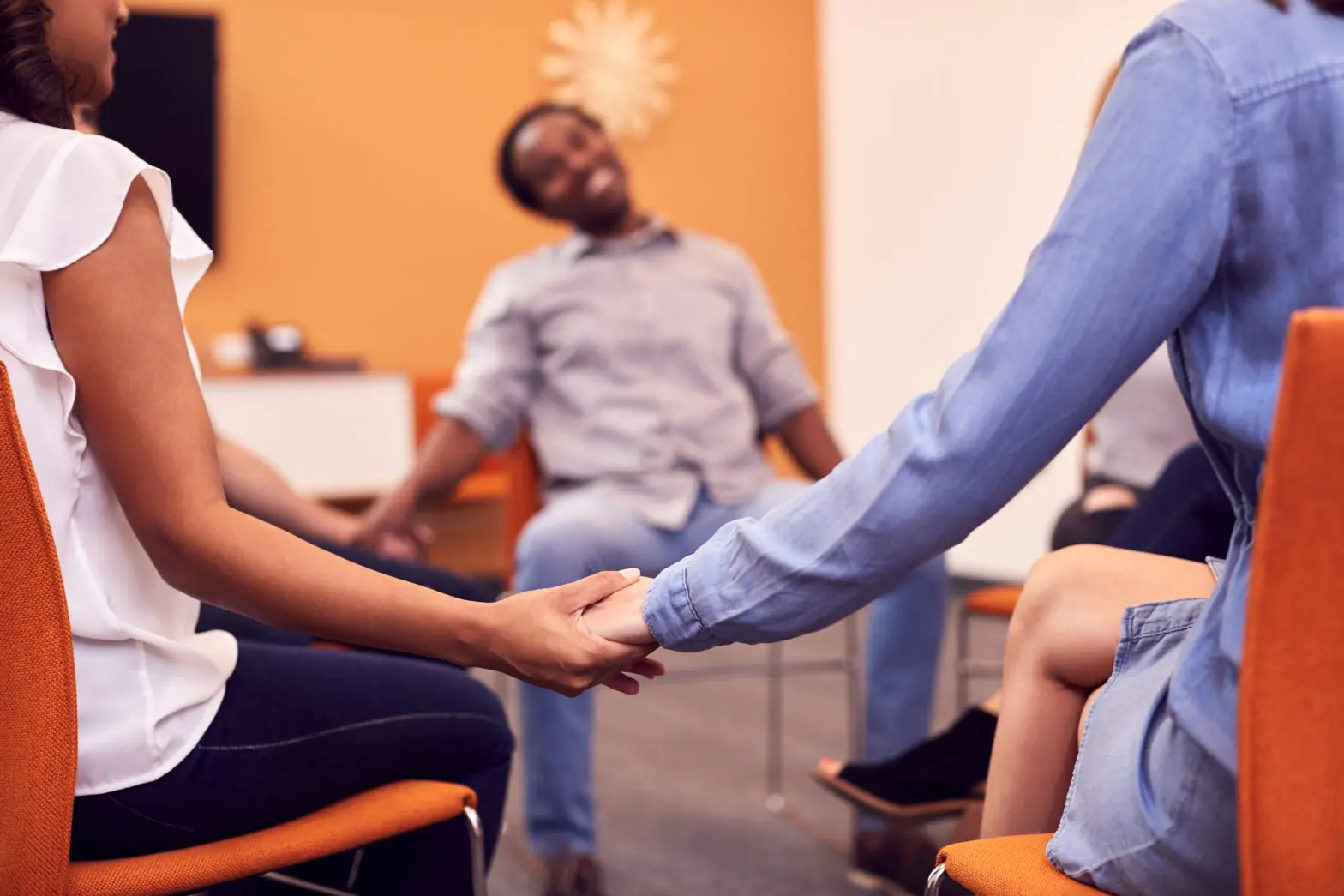 a group of people holding hands