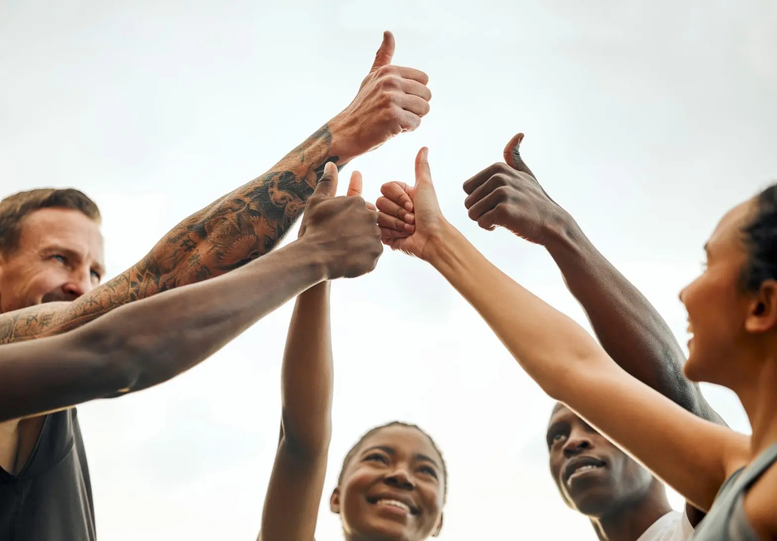 friends holding up their thumbs in a circle to show the power of positive reinforcement therapy