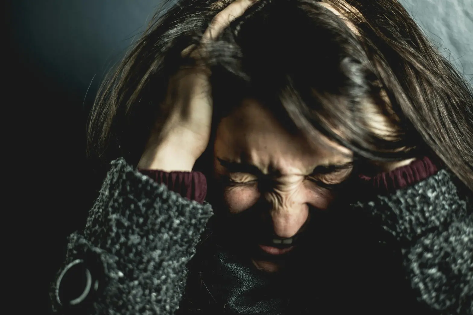 a woman frustrated because of her alcoholic twitch.
