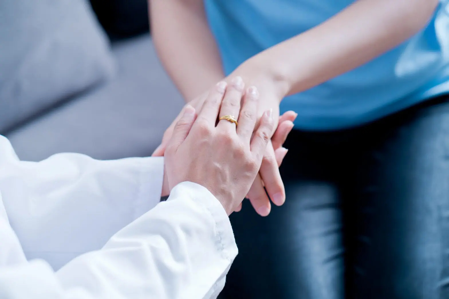 Hand of doctor reassuring her female patient How to Explain C-PTSD to Someone Who Does Not Have It
