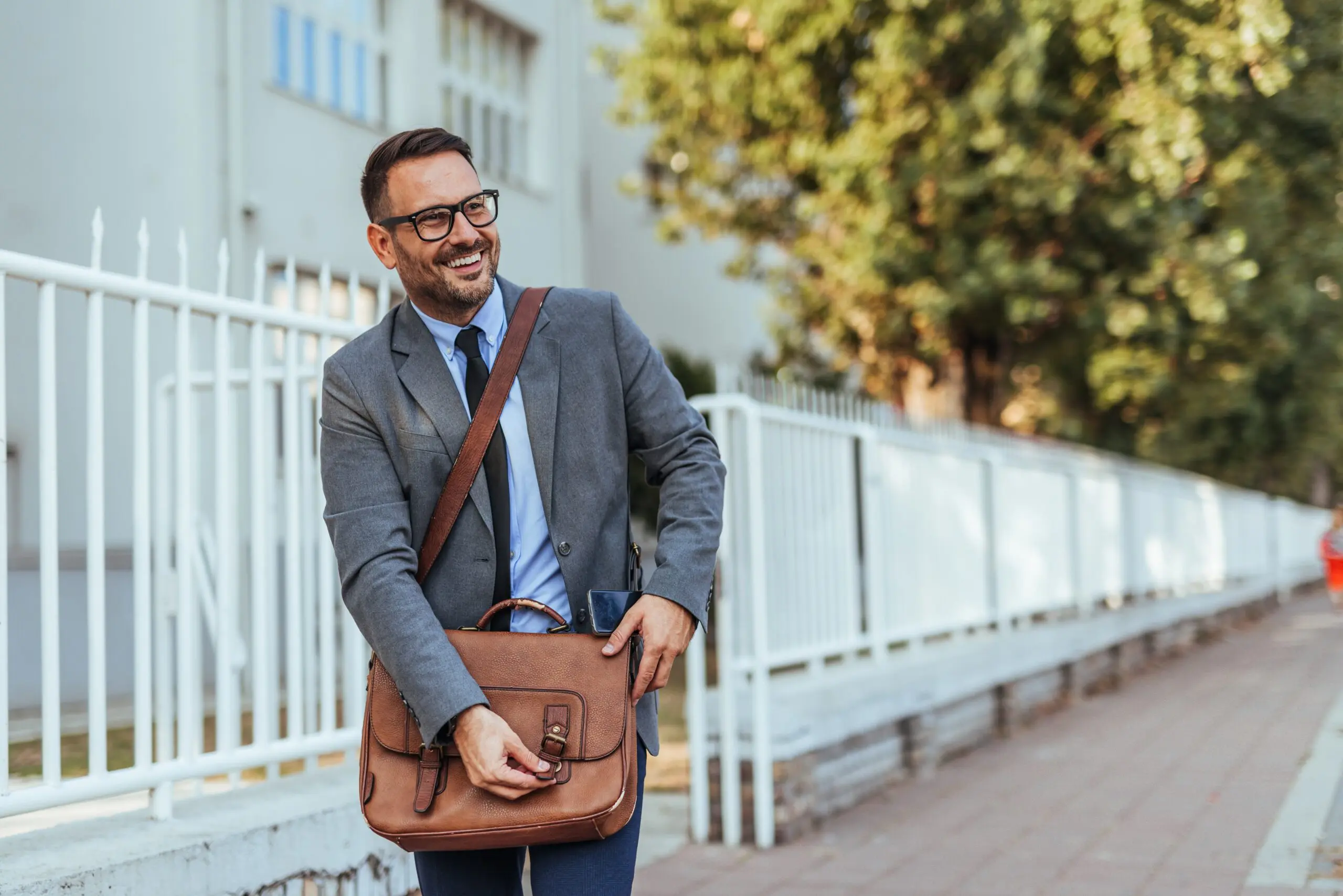 person confidently entering an office building, representing a new beginning after addiction recovery