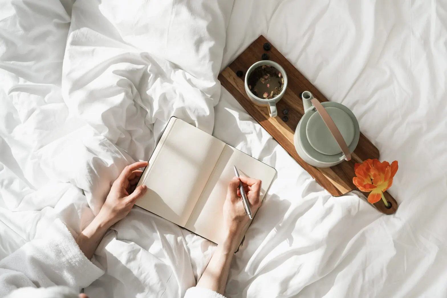 woman writing gratitude list to support daily happiness and emotional balance