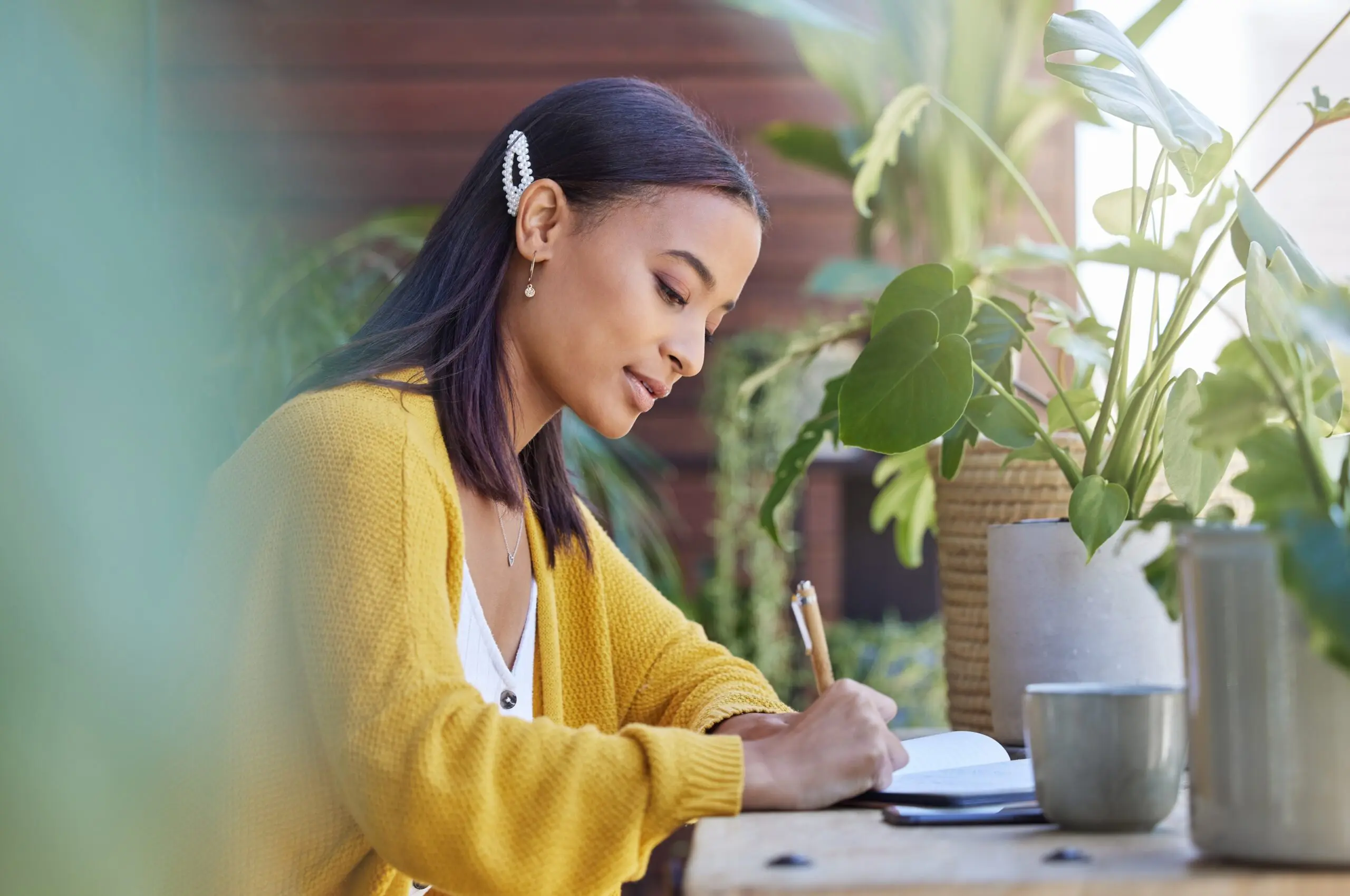 person journaling outdoors in a calm recovery garden