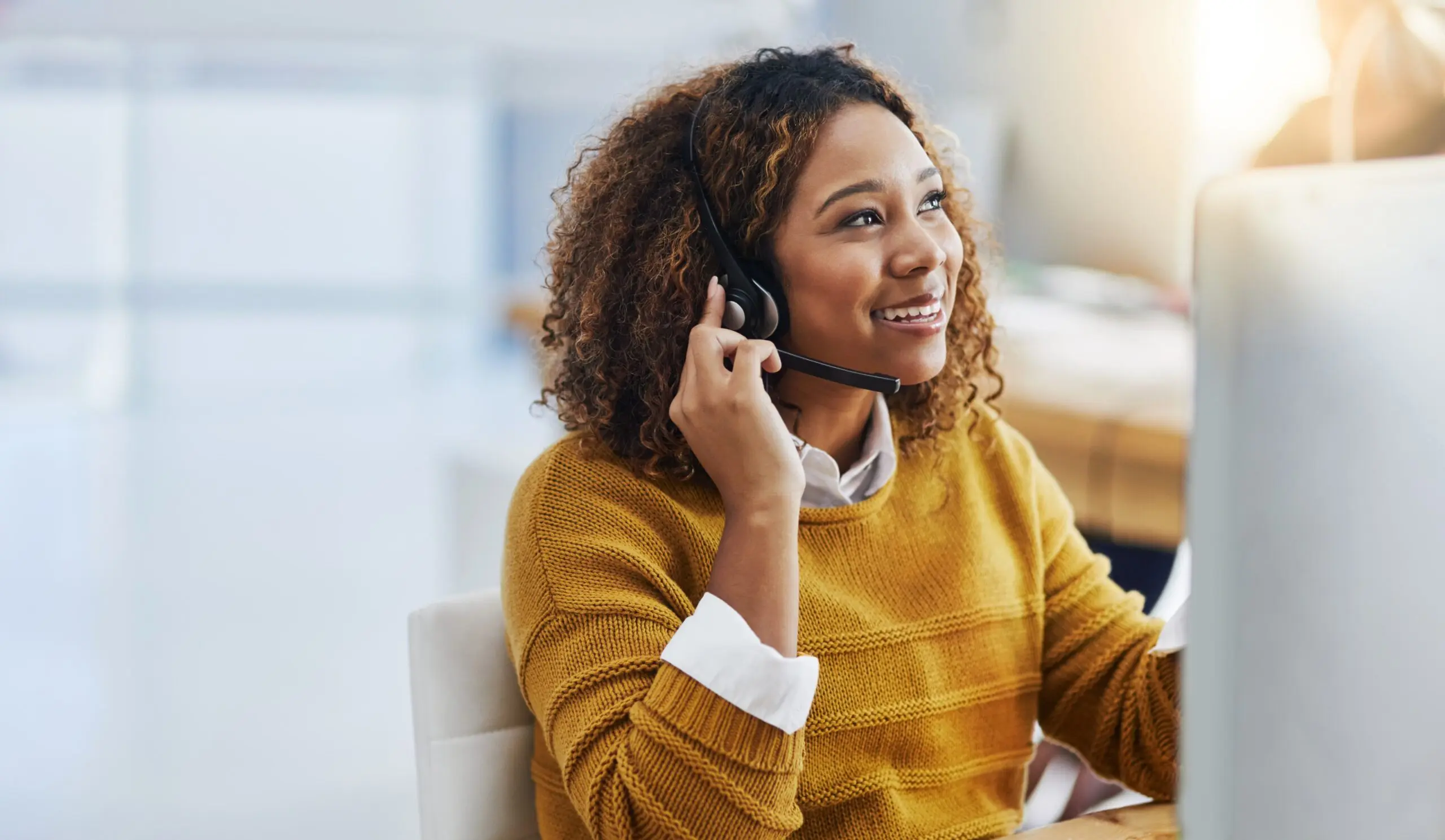 staff member assisting a client with insurance questions over the phone
