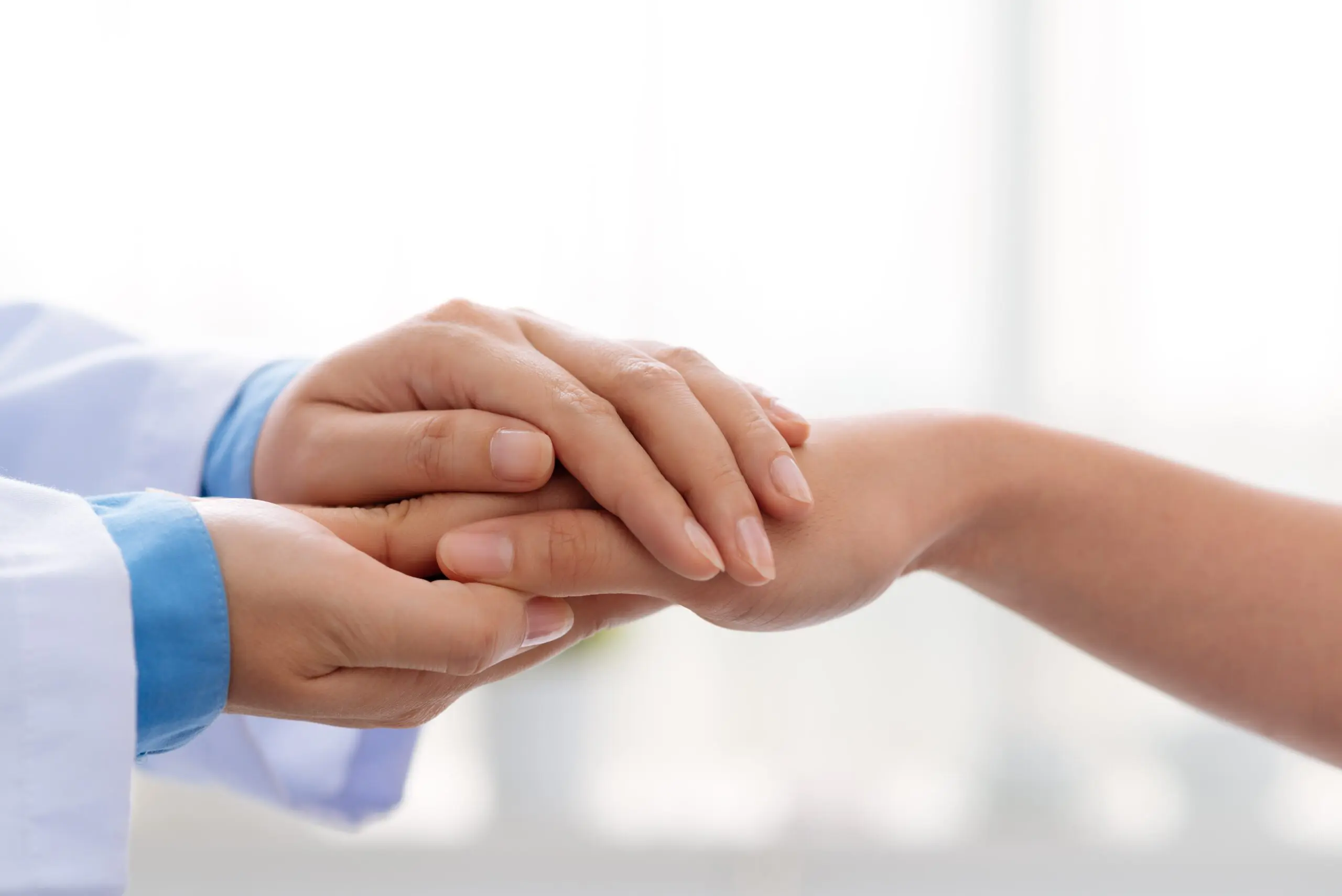 Supportive hand-hold symbolizing trust and openness in Step 5 of the 12-Step Program