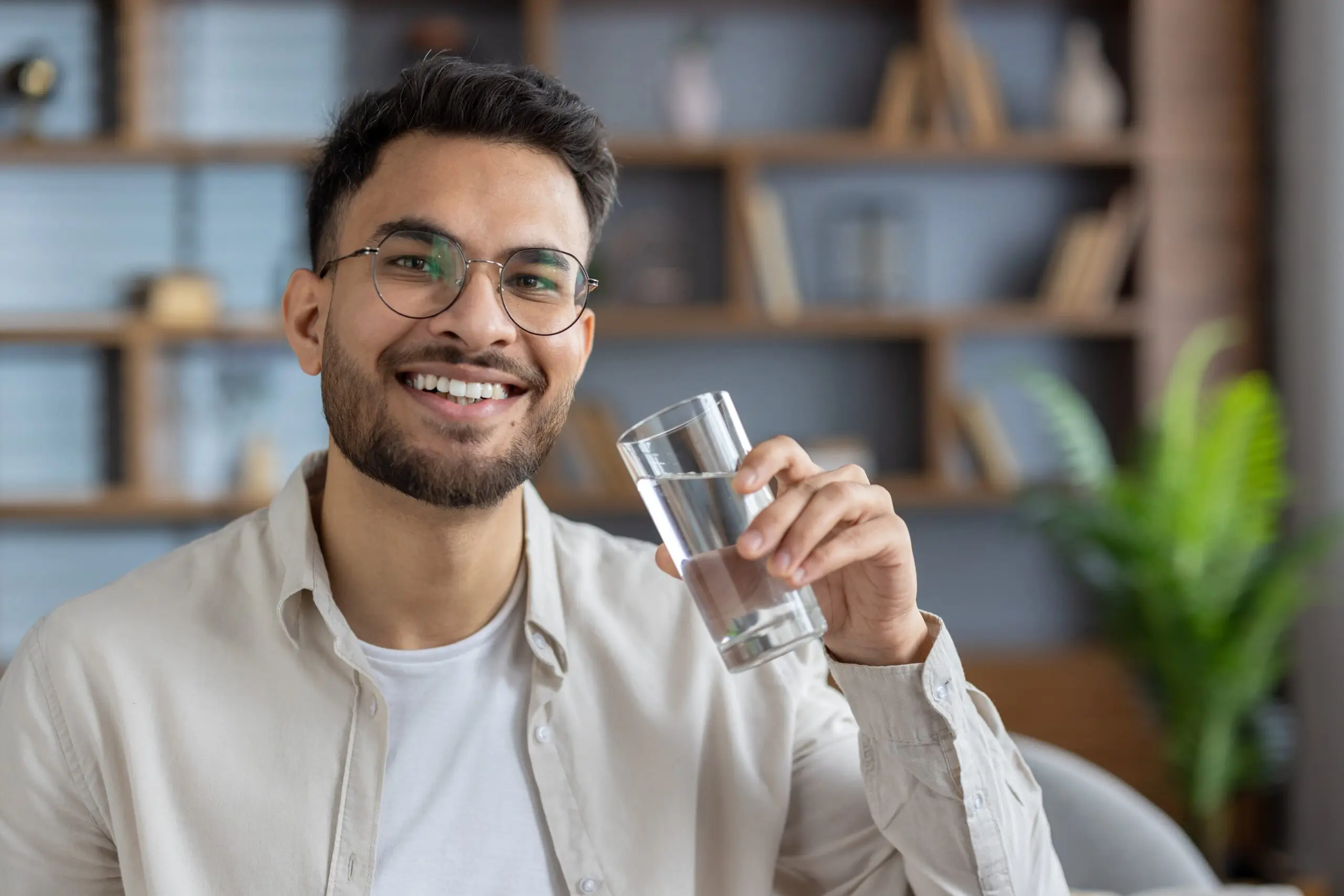 Person drinking water showing why staying hydrated helps with addiction during recovery