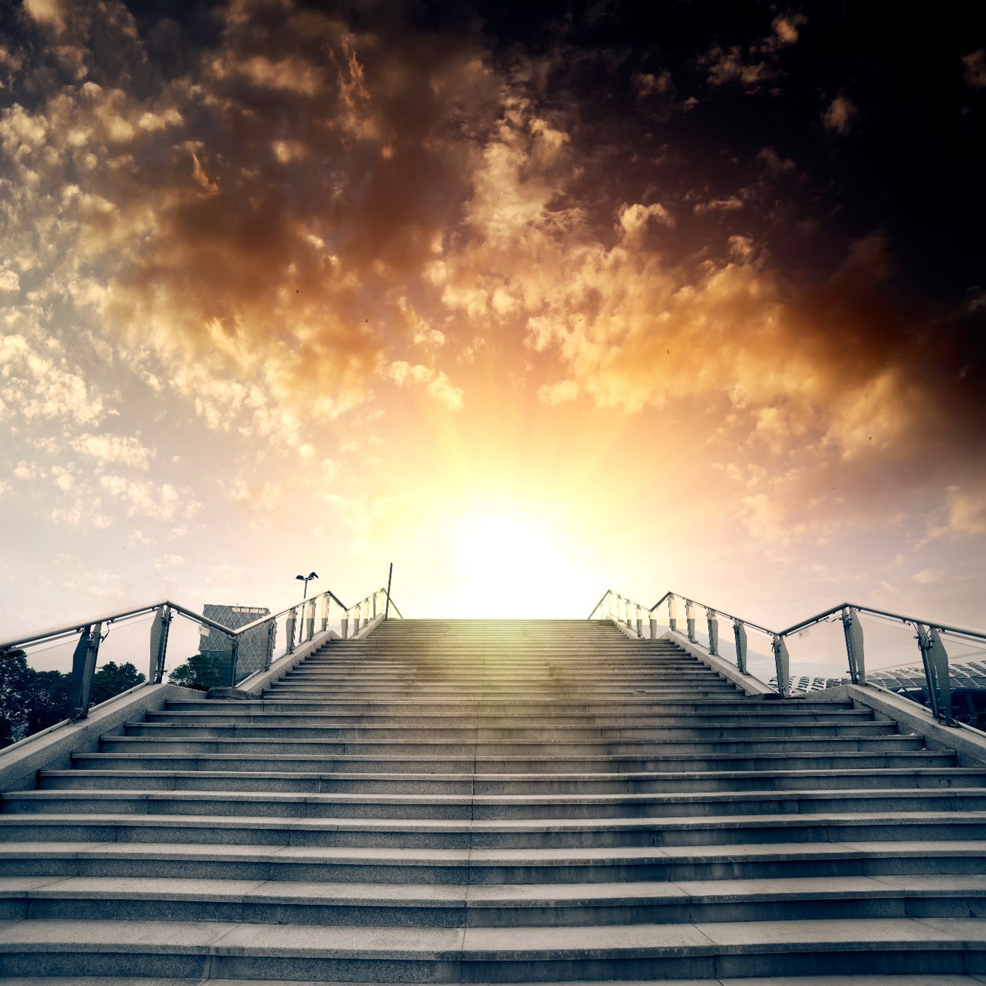 stairs leading to a sunny destination at the top