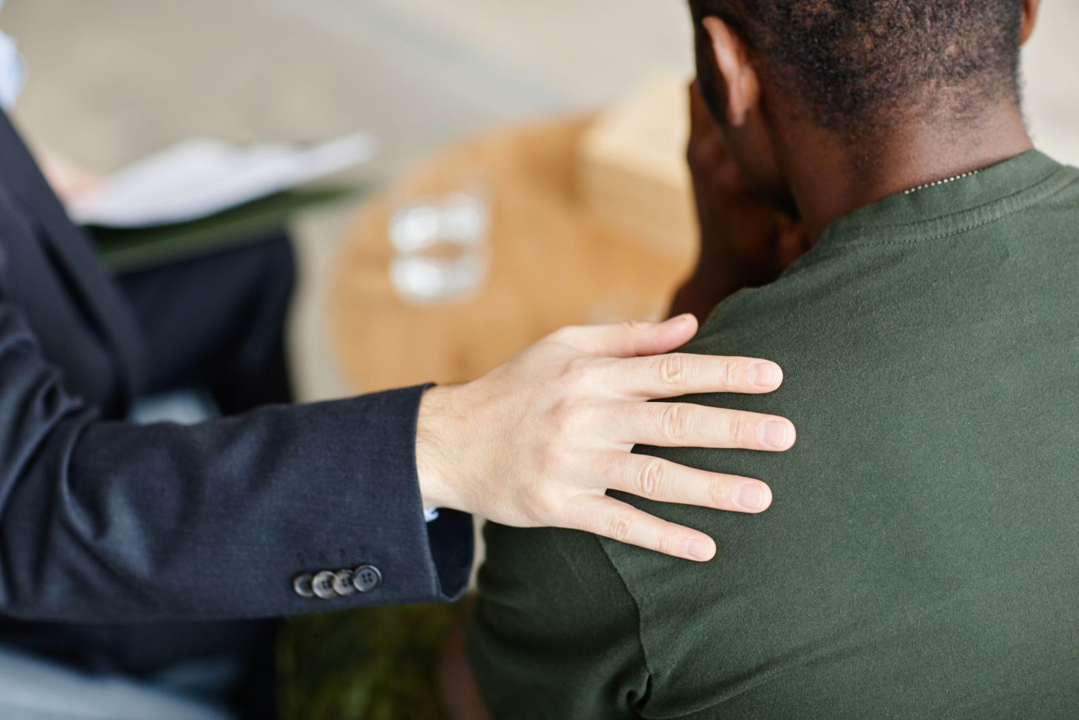 Soldier being comforted due to substance abuse in the military