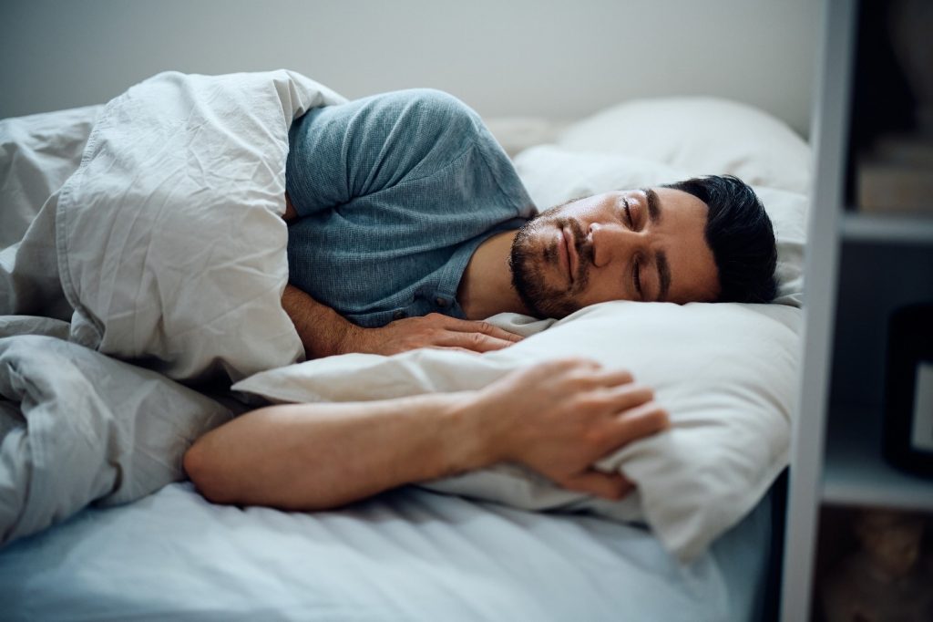 A man sleeping peacefully without alcohol