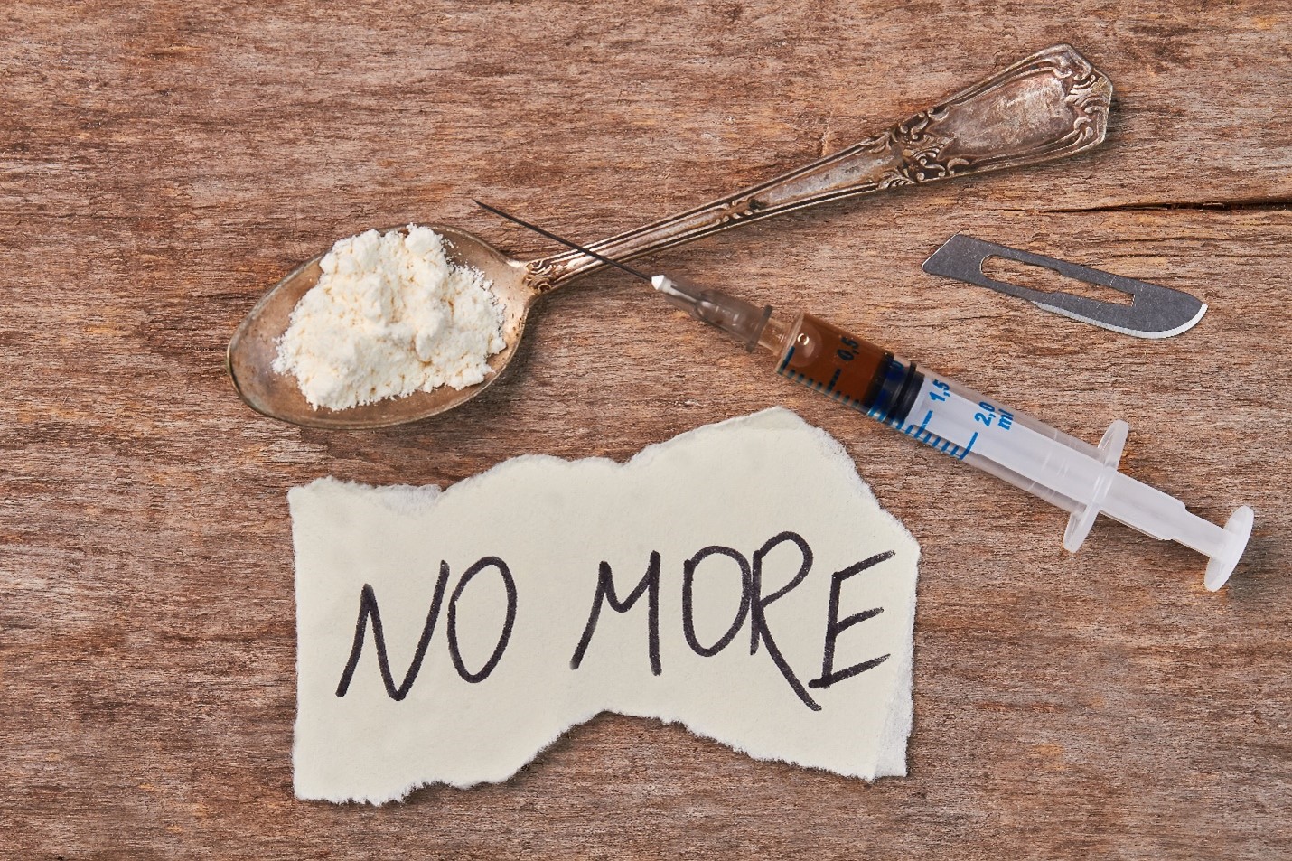 A bunch of drugs with the sign No More, representing a relapse prevention plan