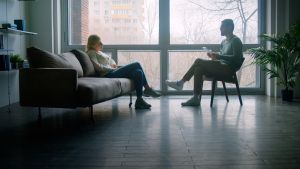 a man and woman sitting on a couch