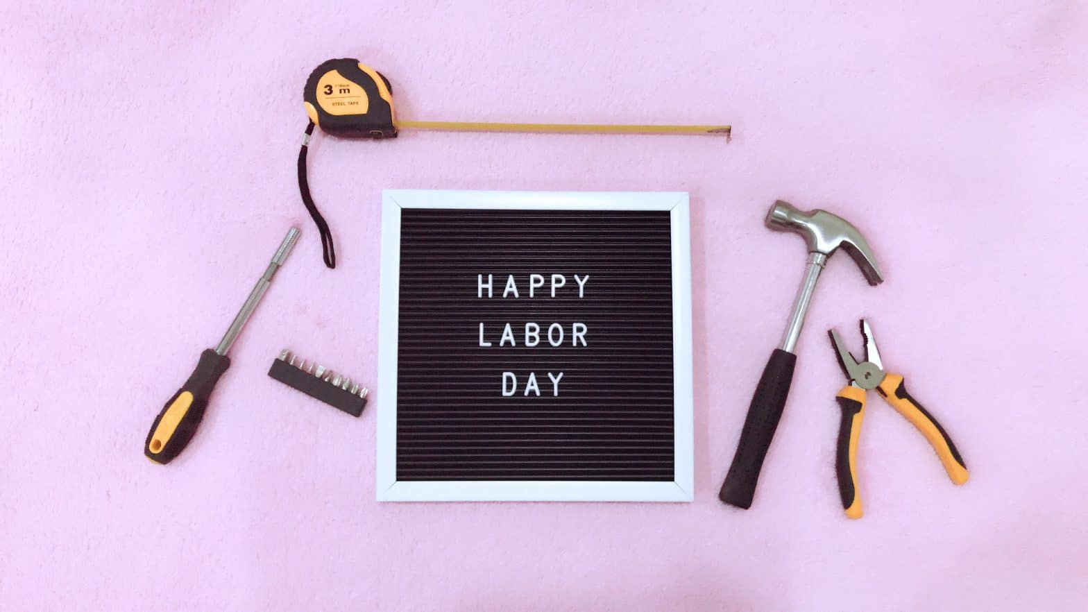 a letter board with tools on it