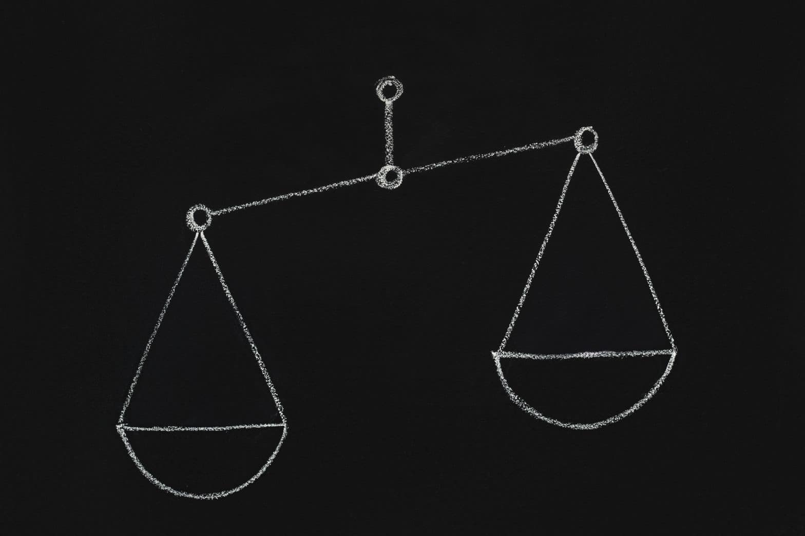 a chalk drawing of a balance scale