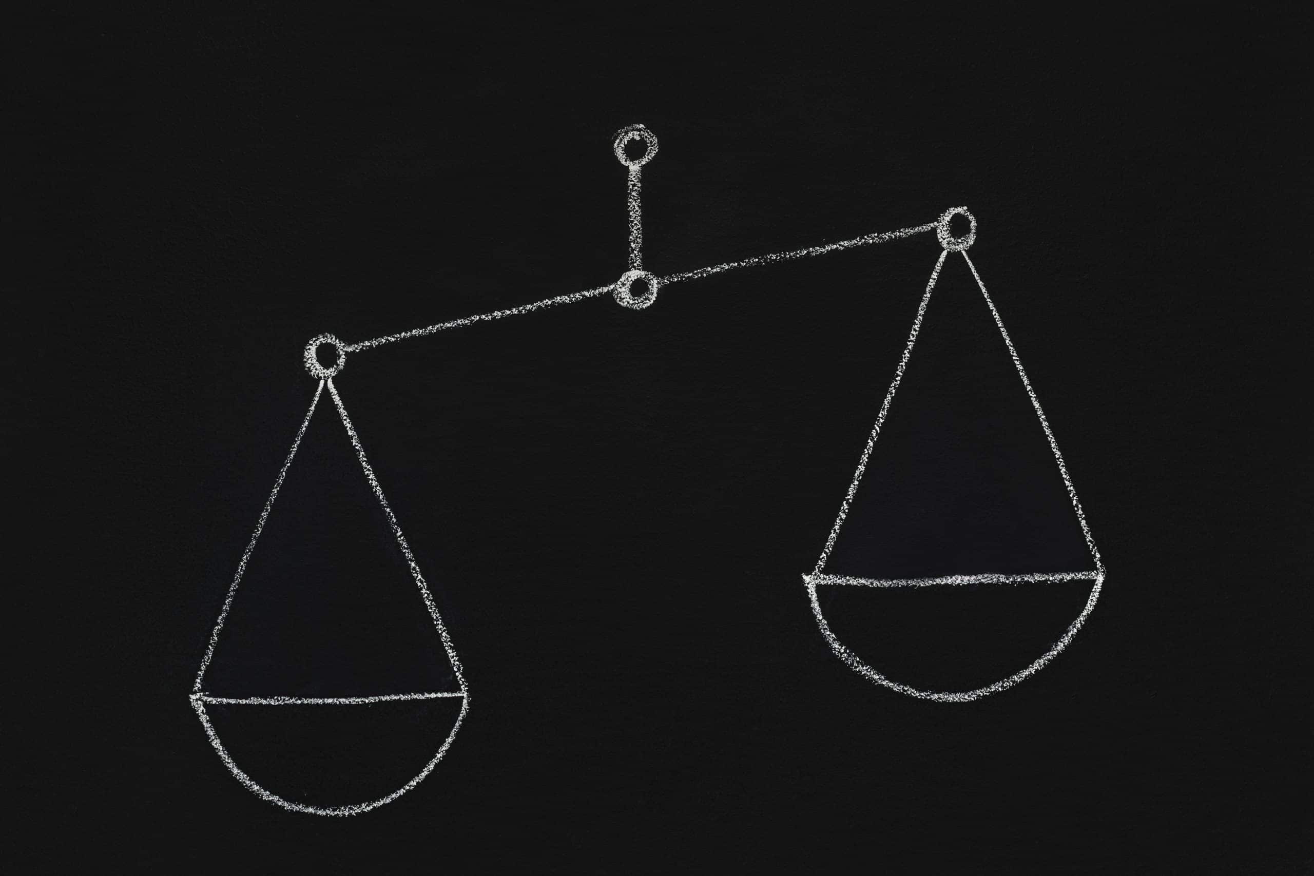 a chalk drawing of a balance scale