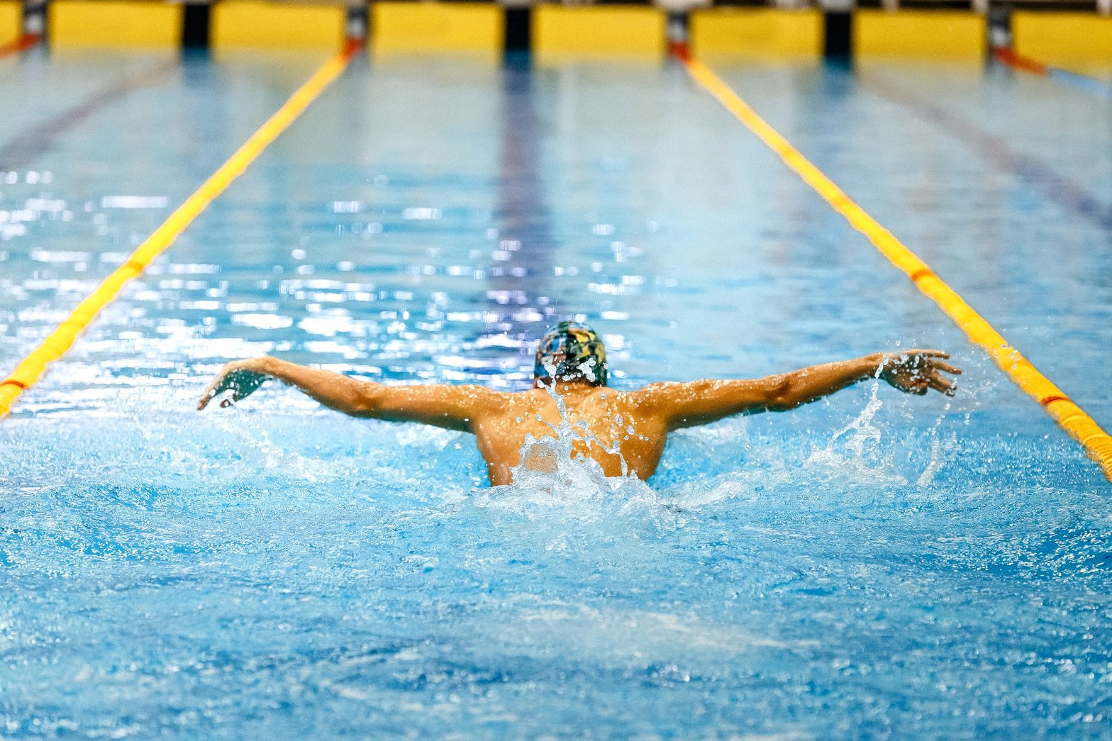 a man swimming in a pool