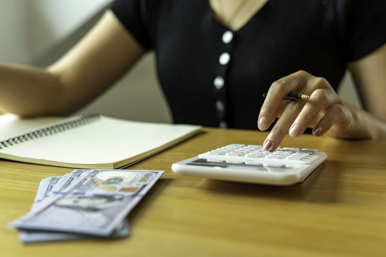 a person using a calculator