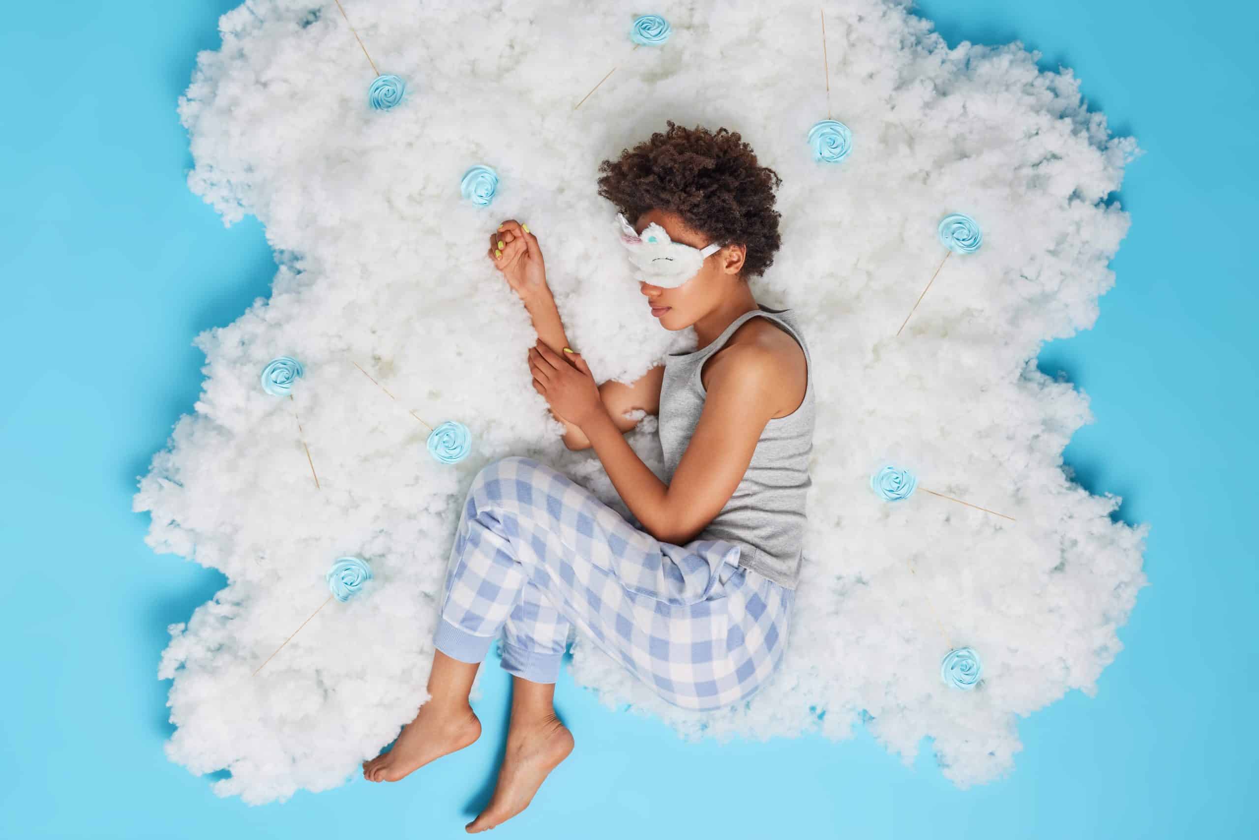 a person lying on the clouds
