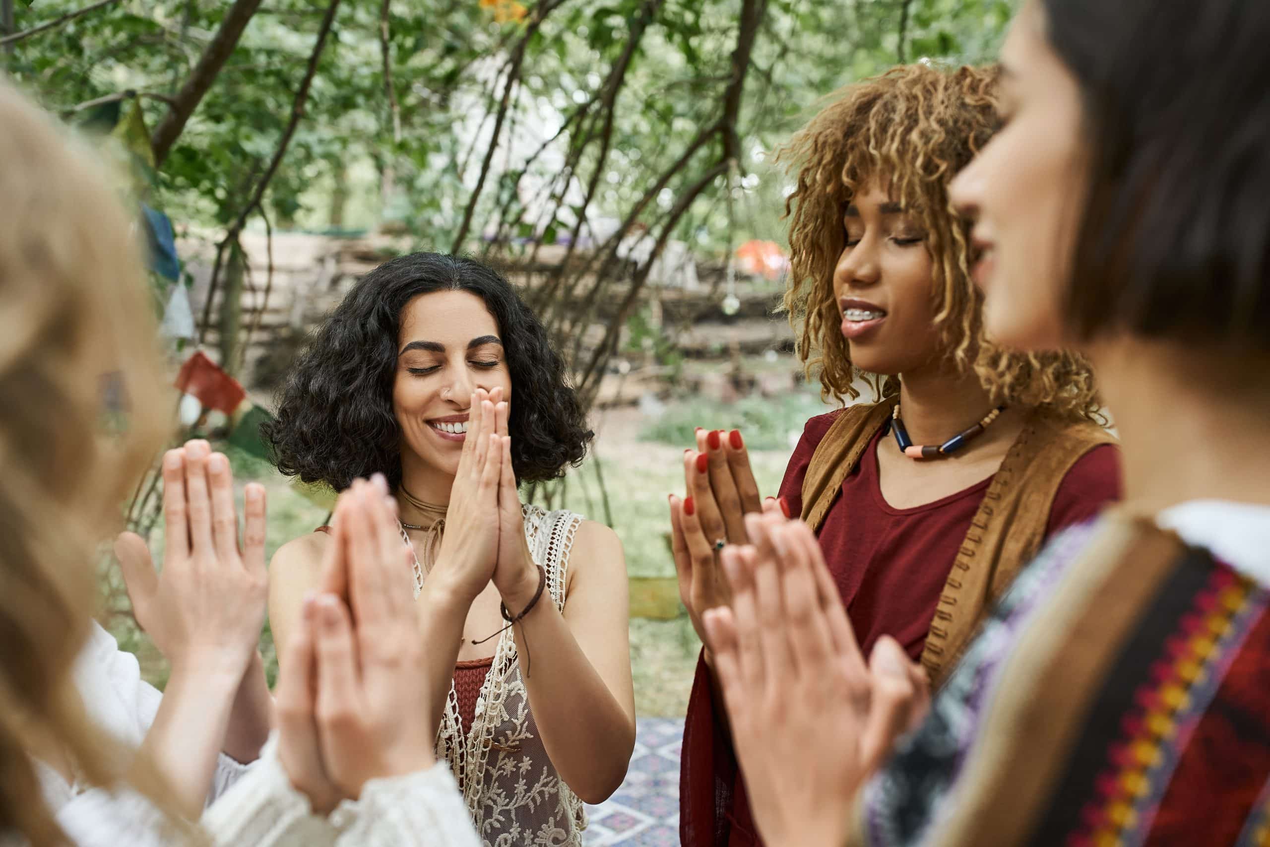 a group of women clapping hands
