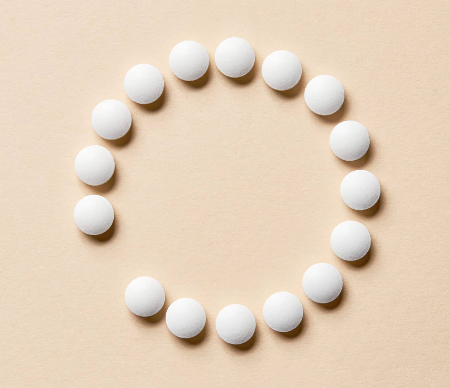 a group of white pills arranged in a circle