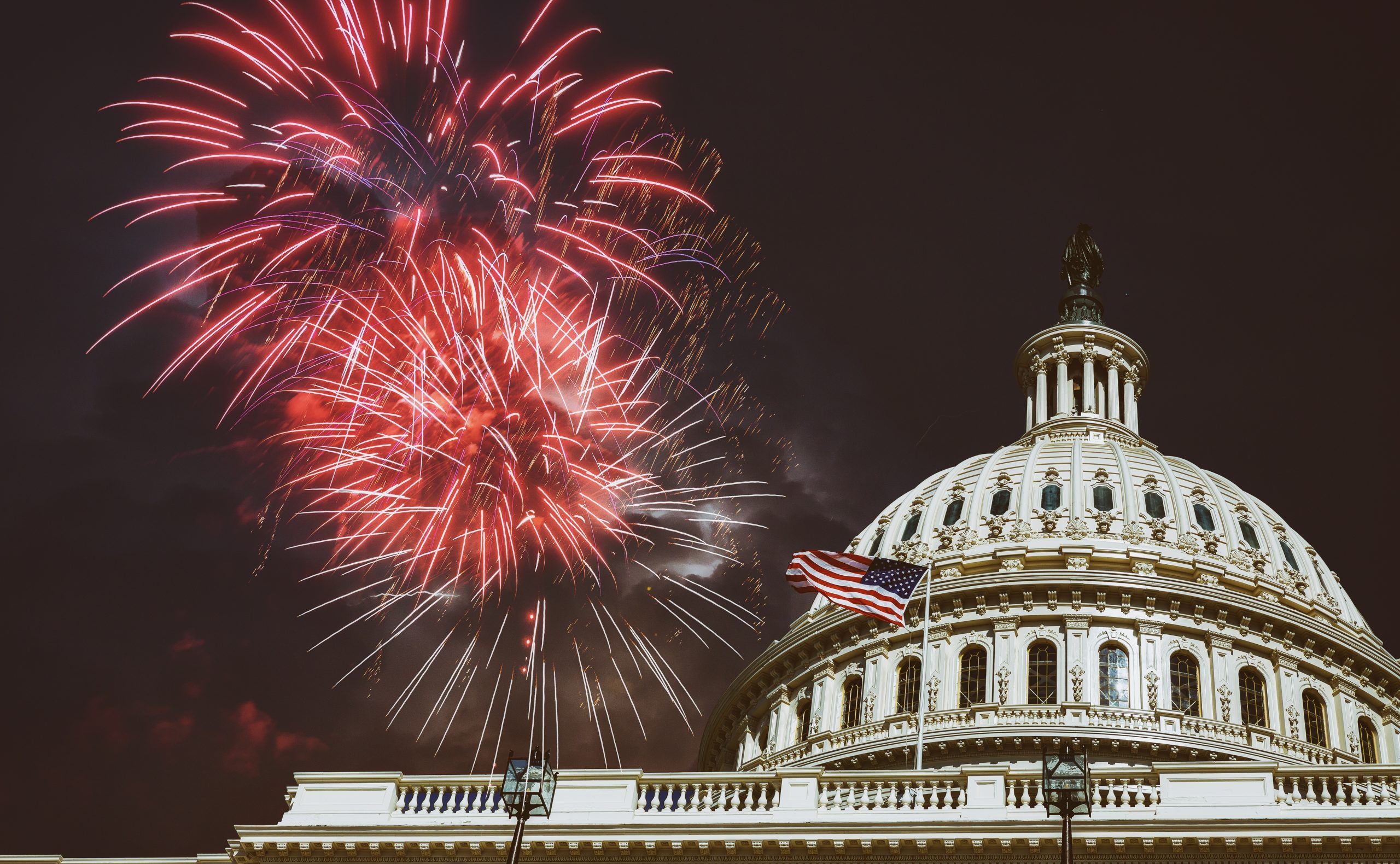 fireworks in the sky over a building