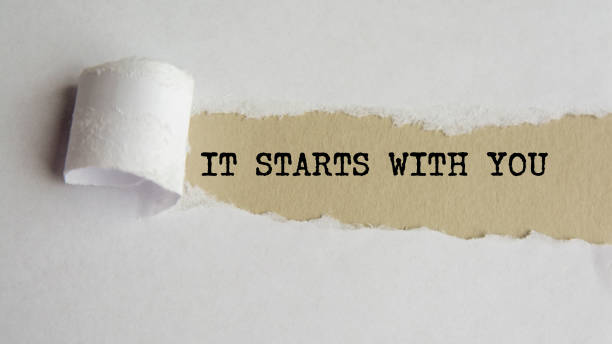 a torn paper with a word