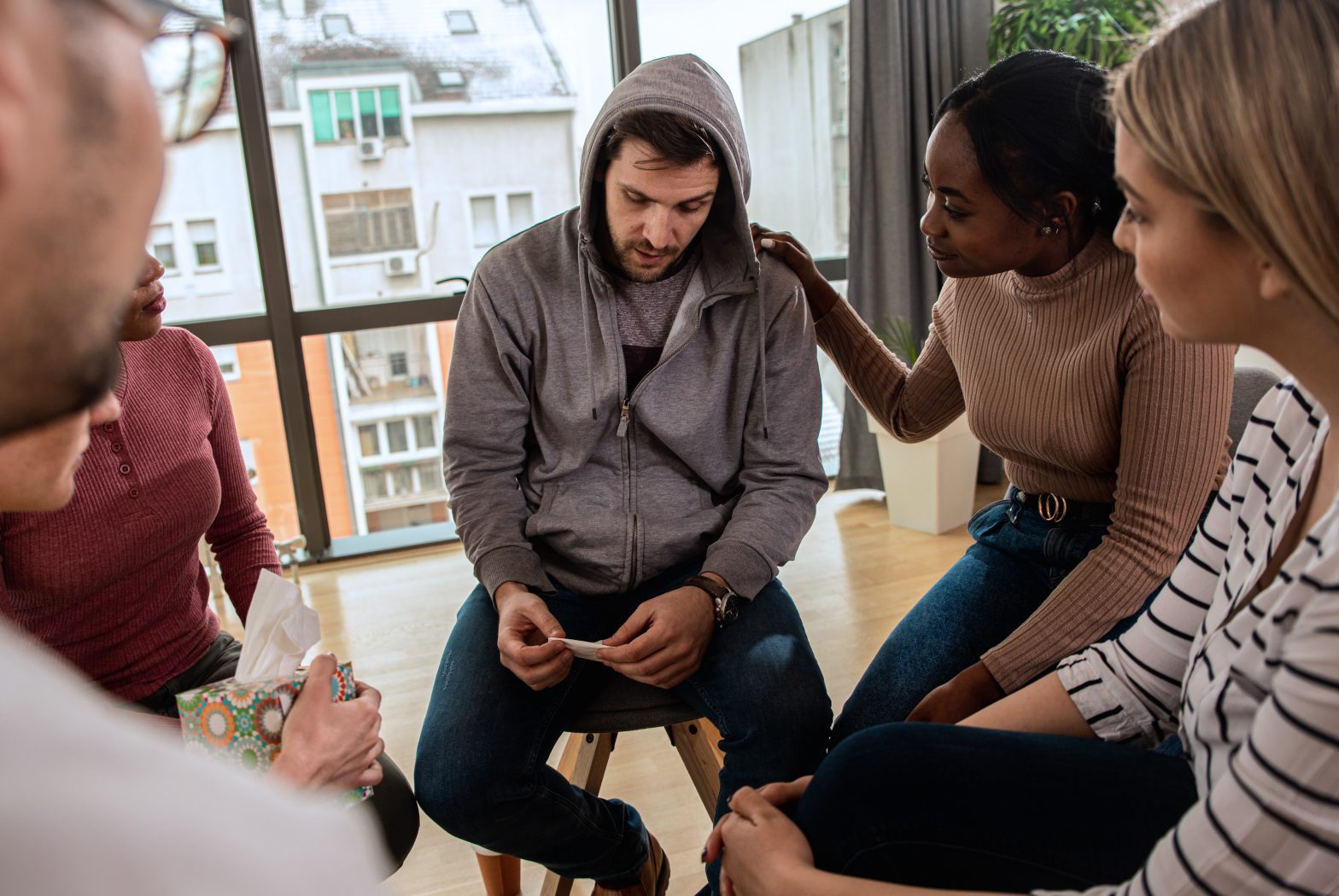 a group of people sitting in a circle