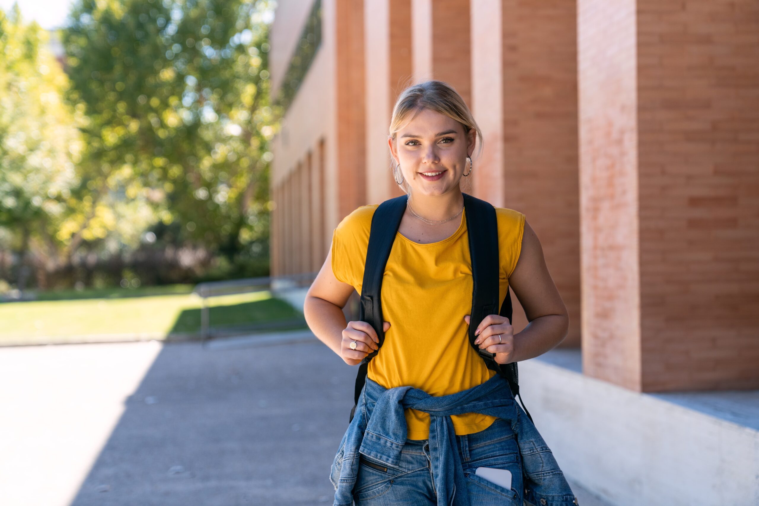 college student walking across campus feeling confident and focused