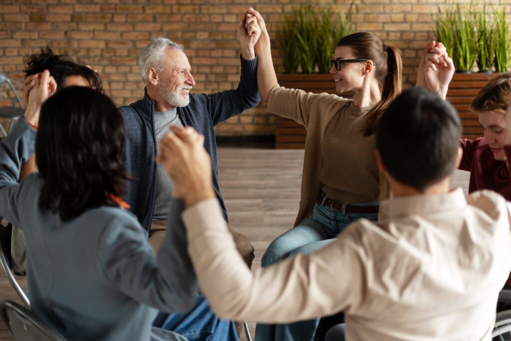 Diverse group engaged in therapy, symbolizing the safe and inclusive environment created by culturally competent care.