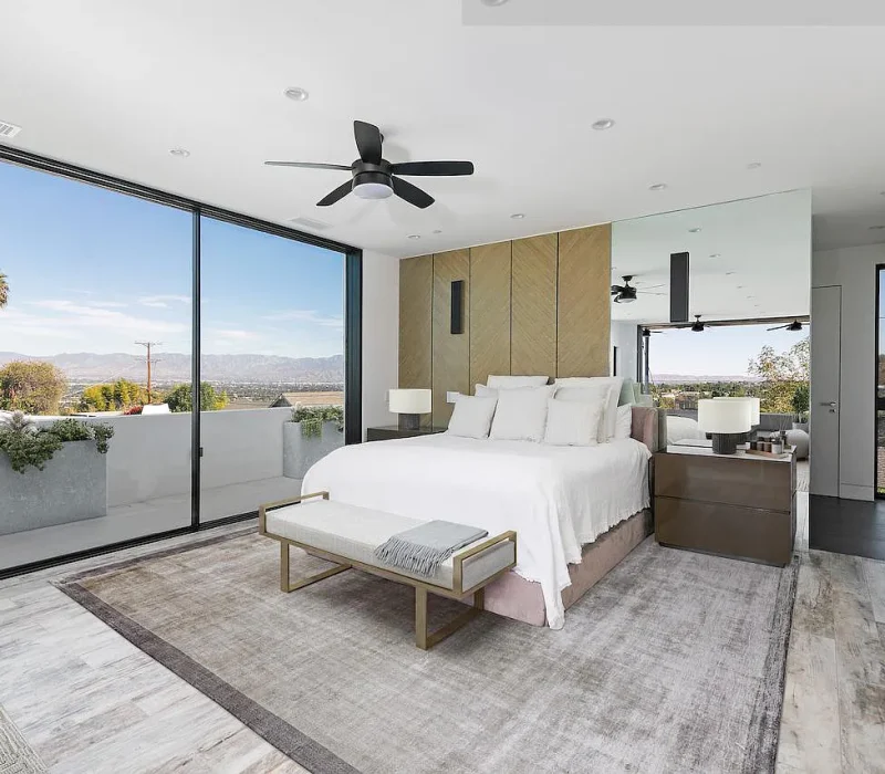 a bedroom with a large window