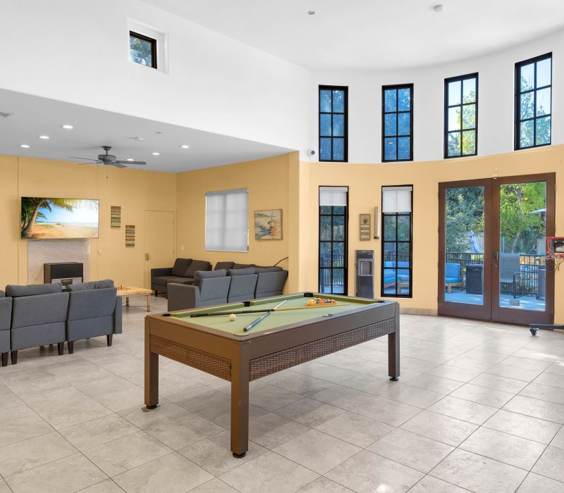 a pool table overlooking the sitting area at Vanity Wellness Center's sober living