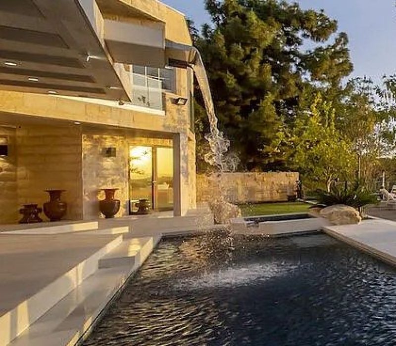 a pool with water pouring out of it