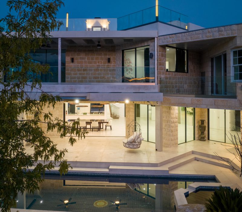 a building with a pool and a table