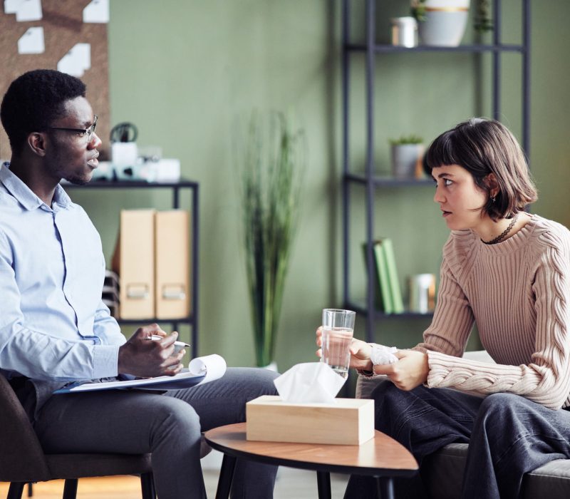 A woman meeting with a man from Vanity Wellness Center's inpatient detox to address her controlled substance addiction